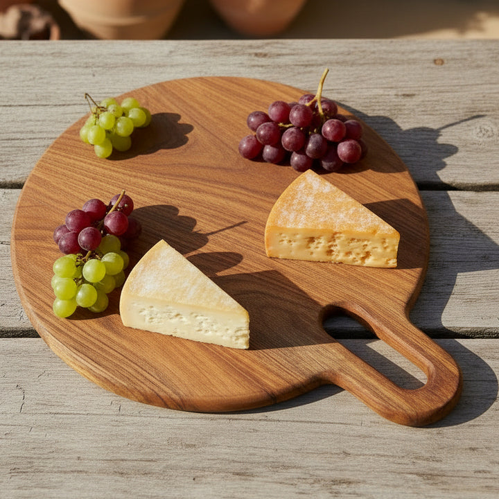 Wooden cutting board with handle on a white background