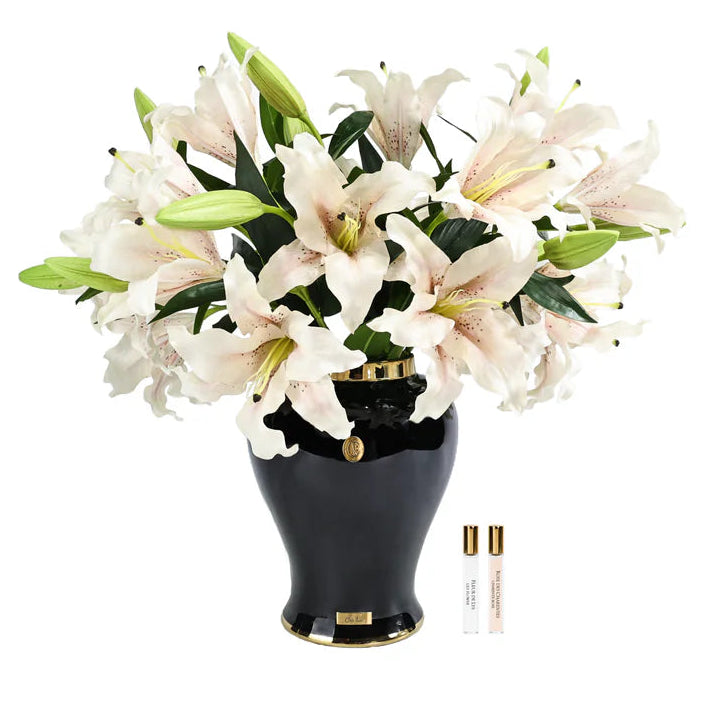 Black vase with white flowers on a white background