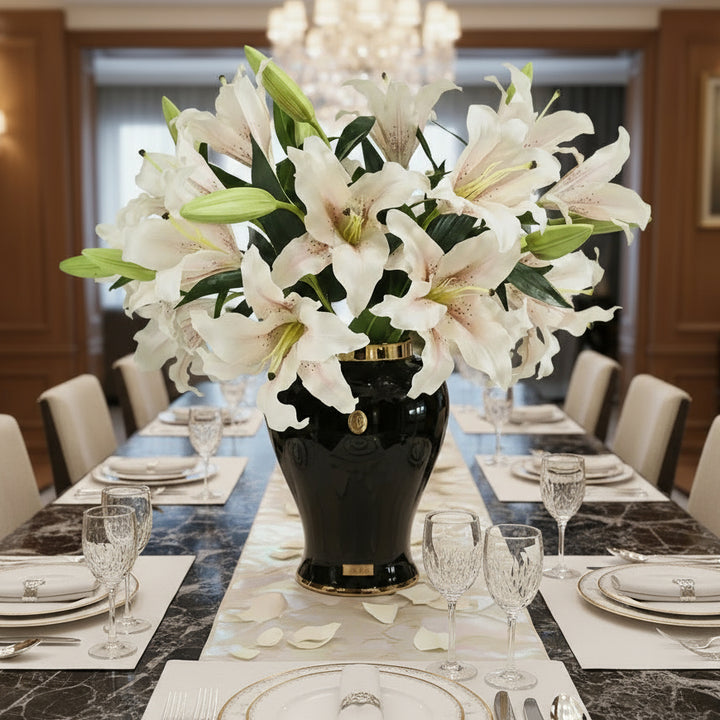 Cote Noire black vase with blush lillies on a white background