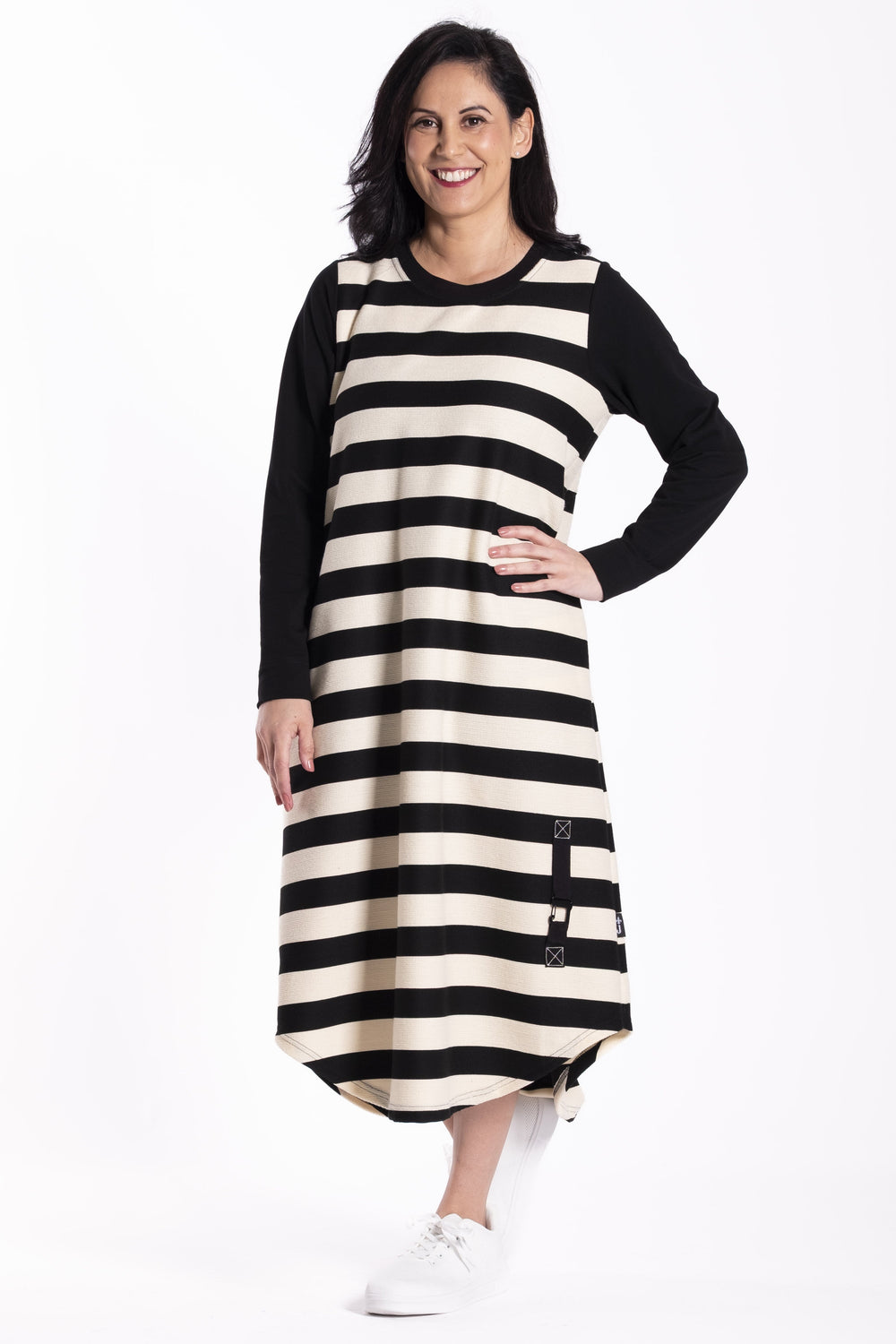 Woman wearing a black and white striped Jellicoe Simone dress on a white background