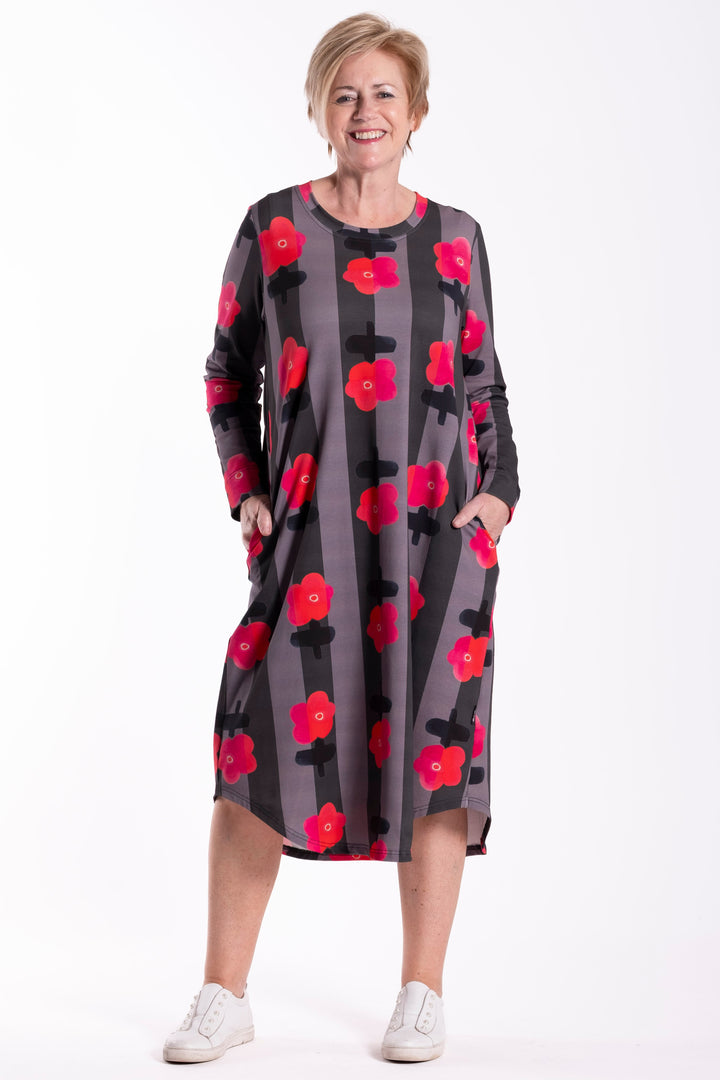 Woman wearing a floral dress on a white background