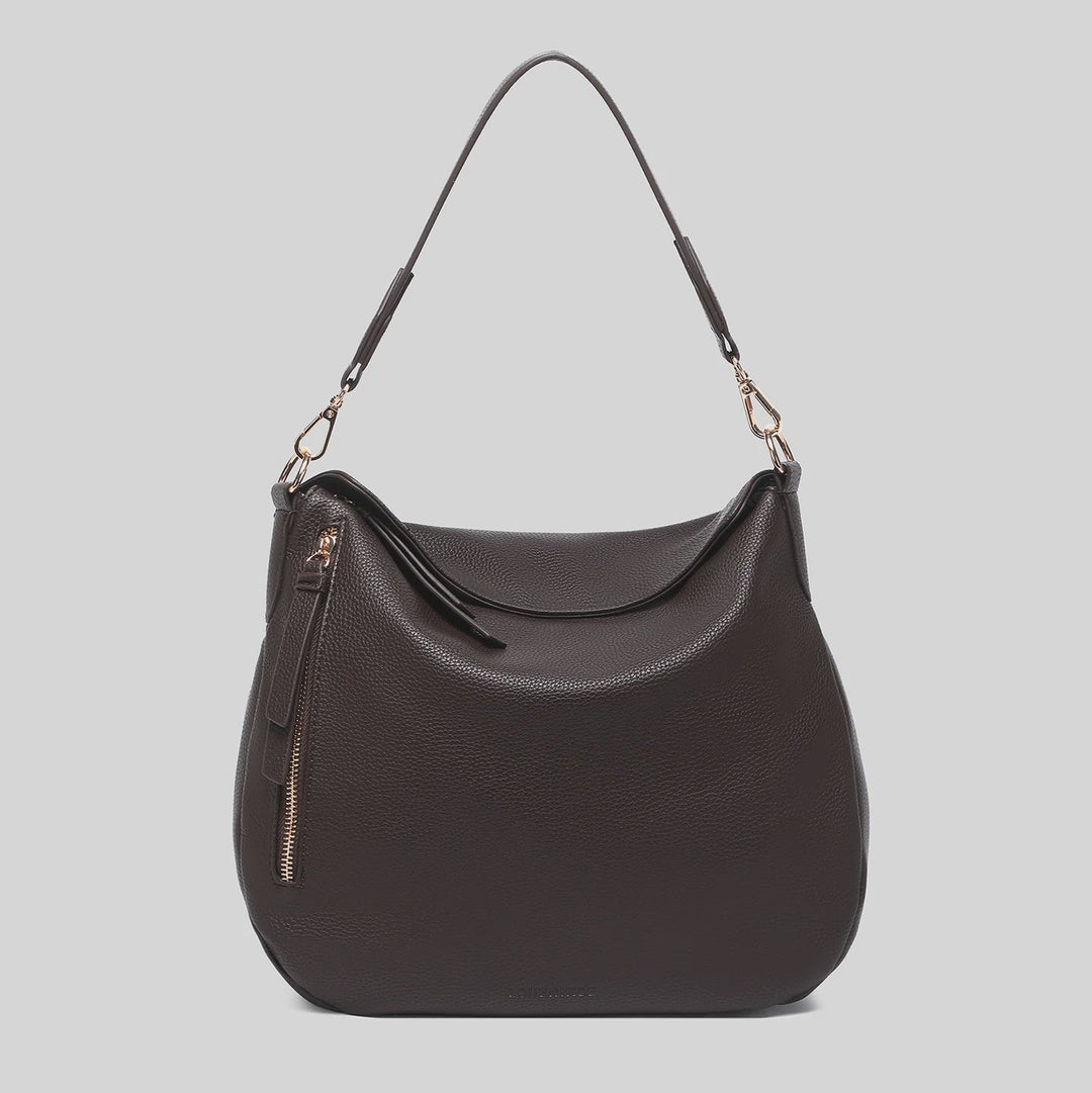 Dark brown handbag with a shoulder strap on a light gray background