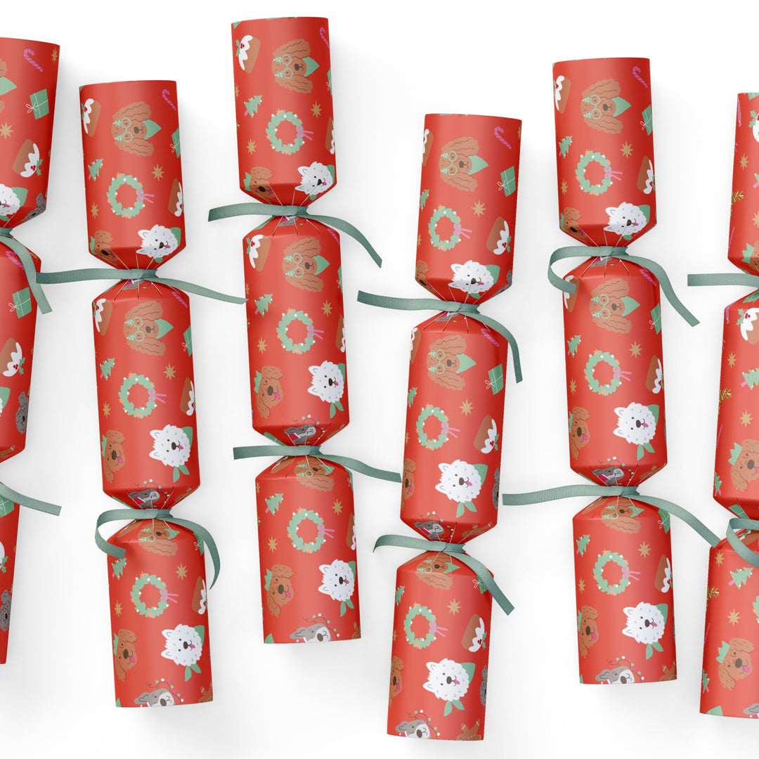 Red DOG CHRISTMAS cracker decorations with floral patterns on a white background