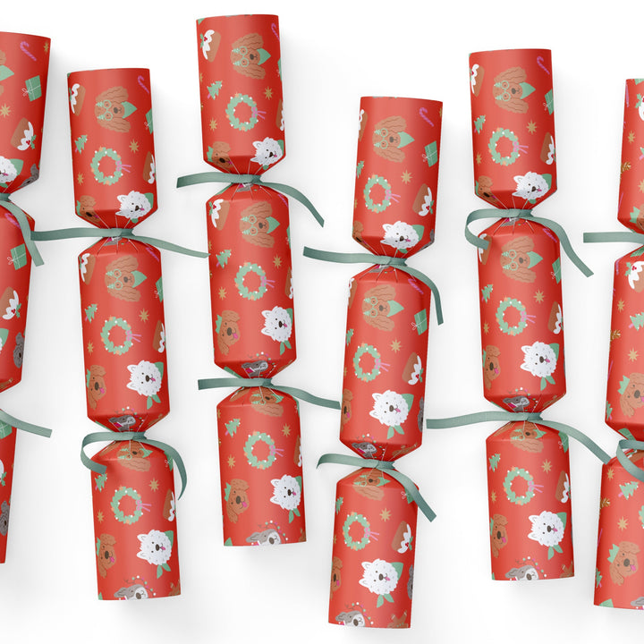 Red DOG CHRISTMAS cracker decorations with floral patterns on a white background
