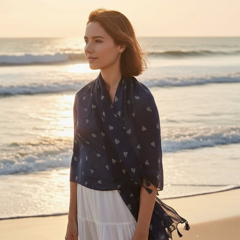 Navy blue scarf with subtle pattern on a white background