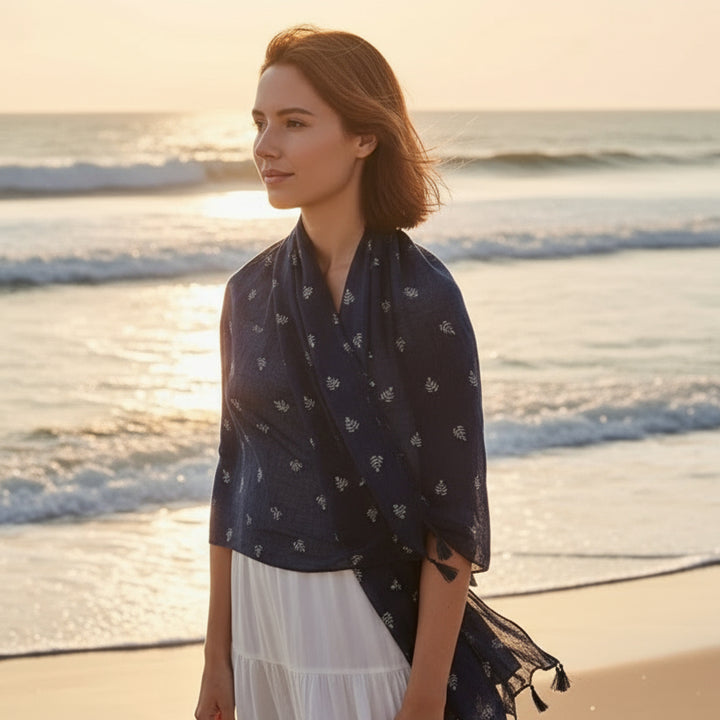 Navy blue scarf with subtle pattern on a white background