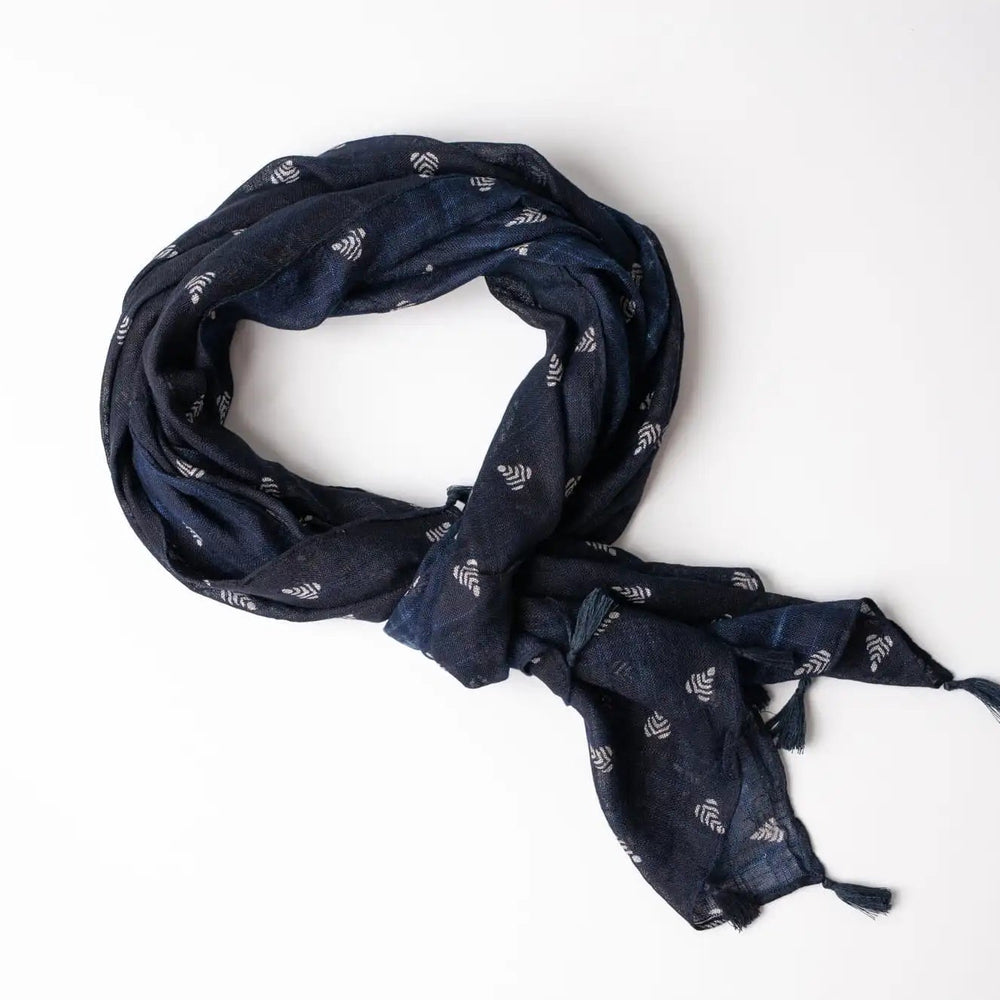 Navy blue scarf with subtle pattern on a white background