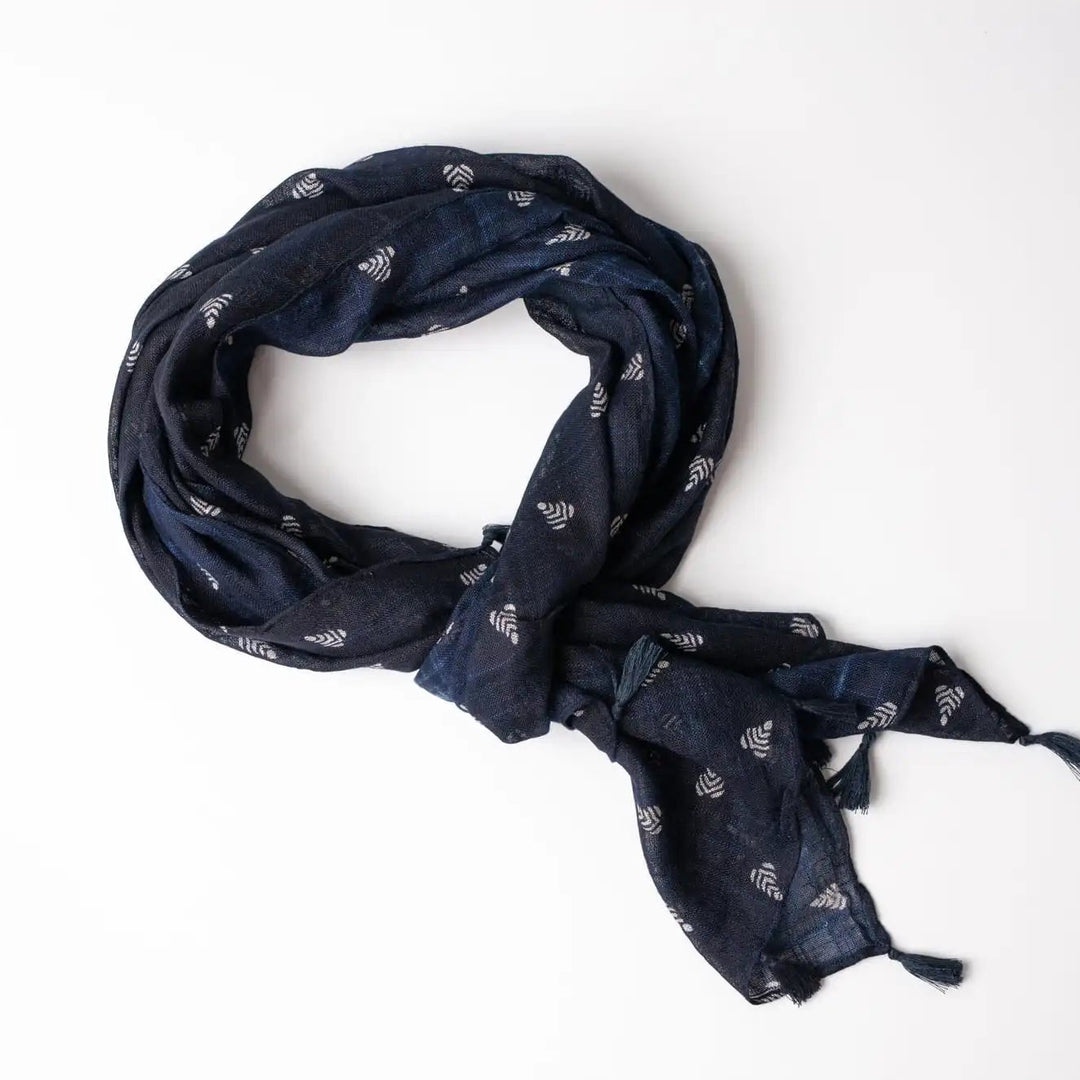 Navy blue scarf with subtle pattern on a white background