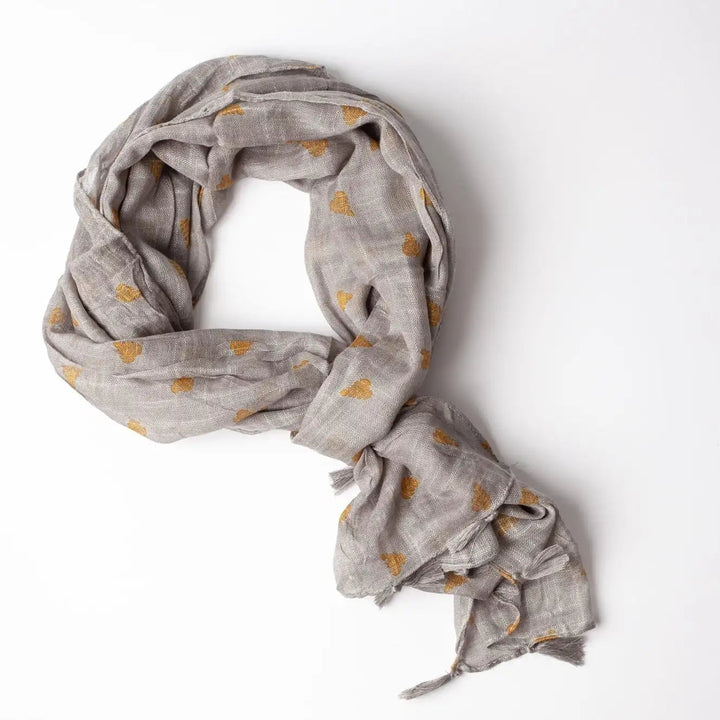 Gray scarf with gold polka dots on a white background