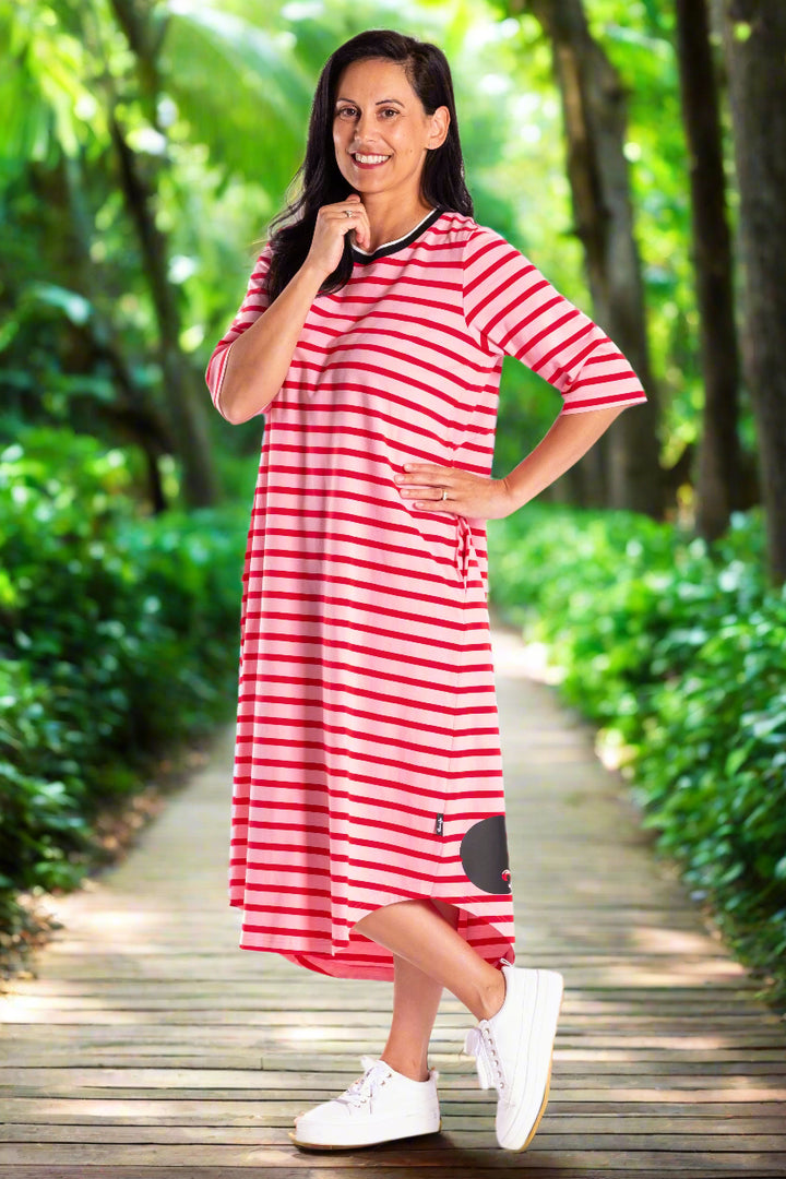 Woman wearing a red and white striped jellicoe dress on a white background