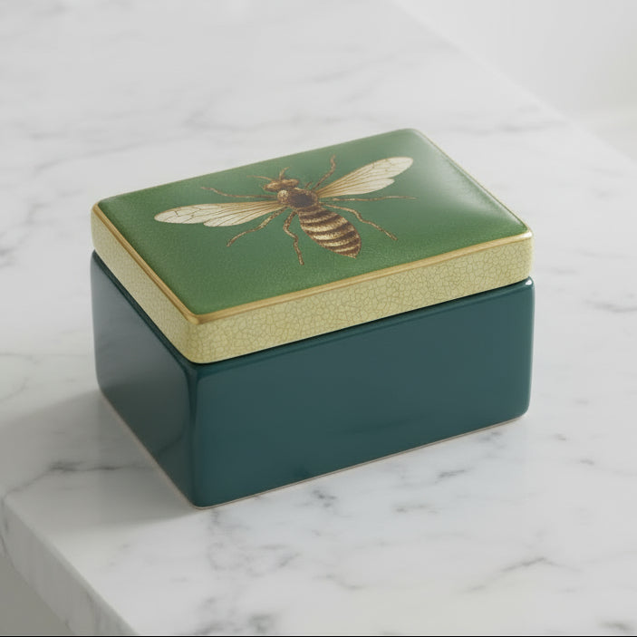 Decorative box with bee design on lid and inset image