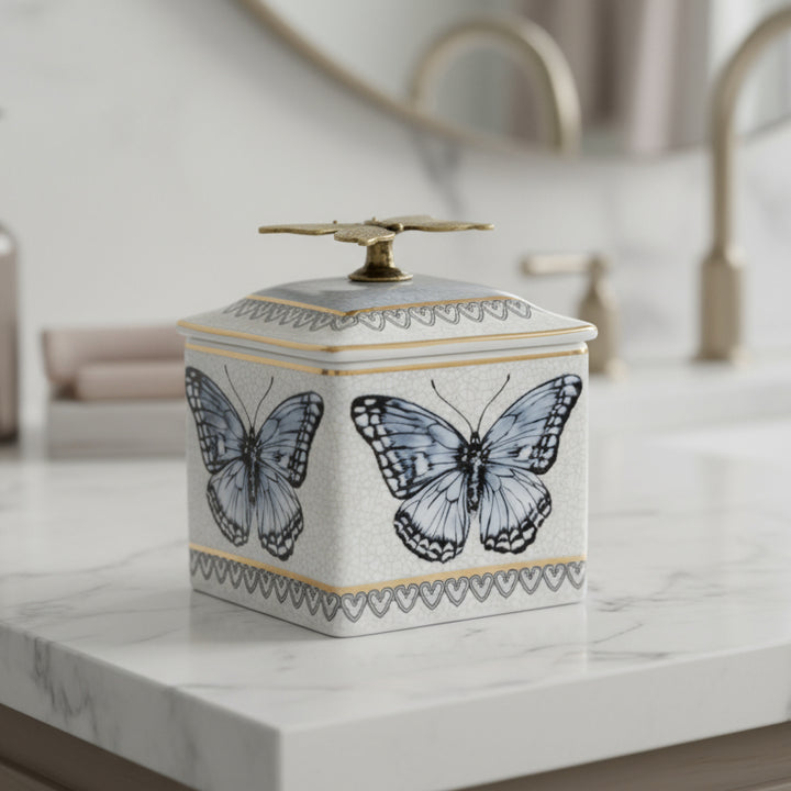 Decorative box with butterfly design and matching napkin in the corner