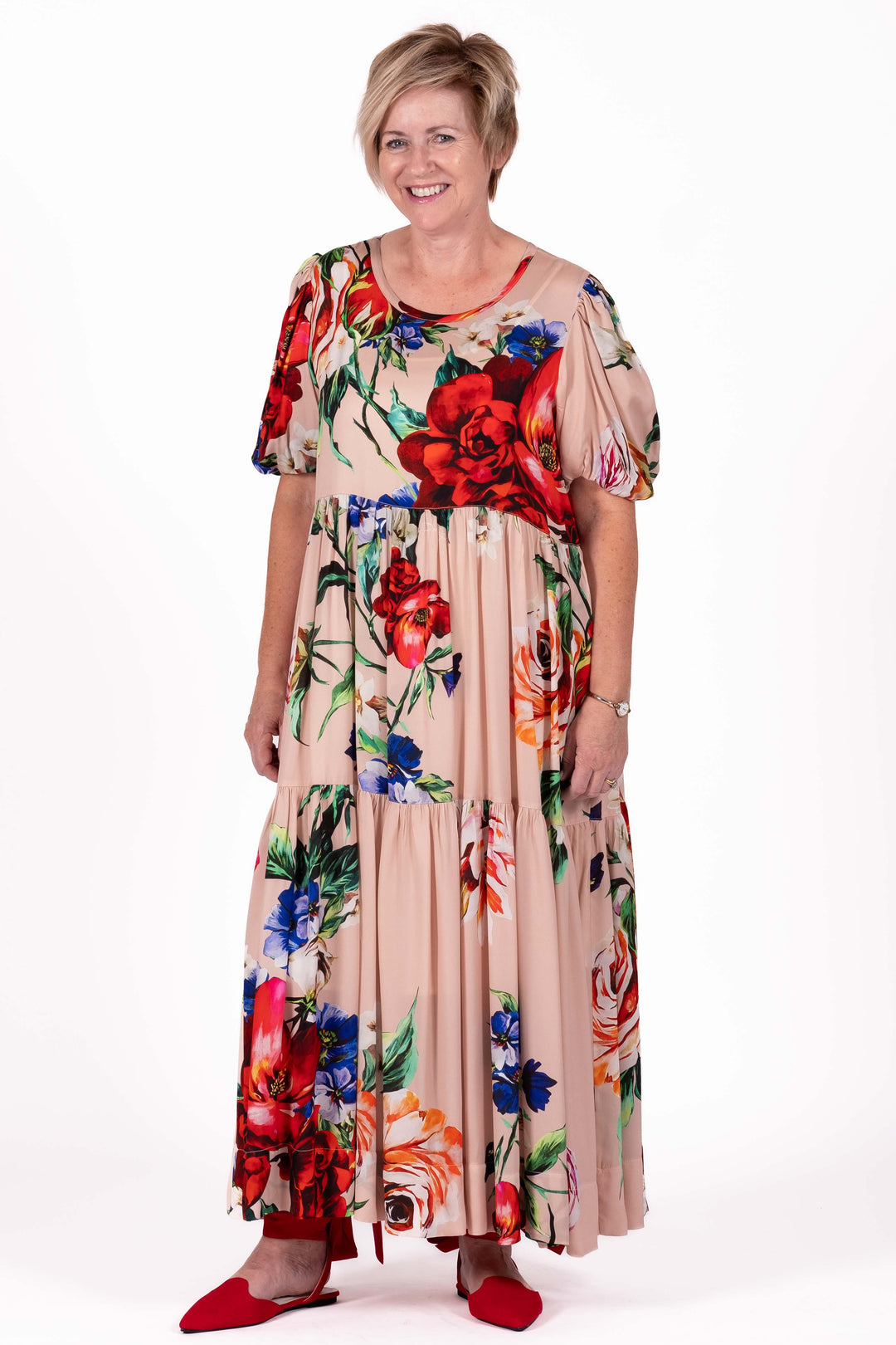 Woman wearing a floral dress on a white background