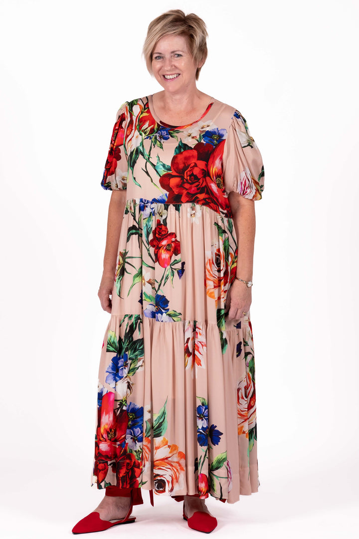 Woman wearing a floral dress on a white background