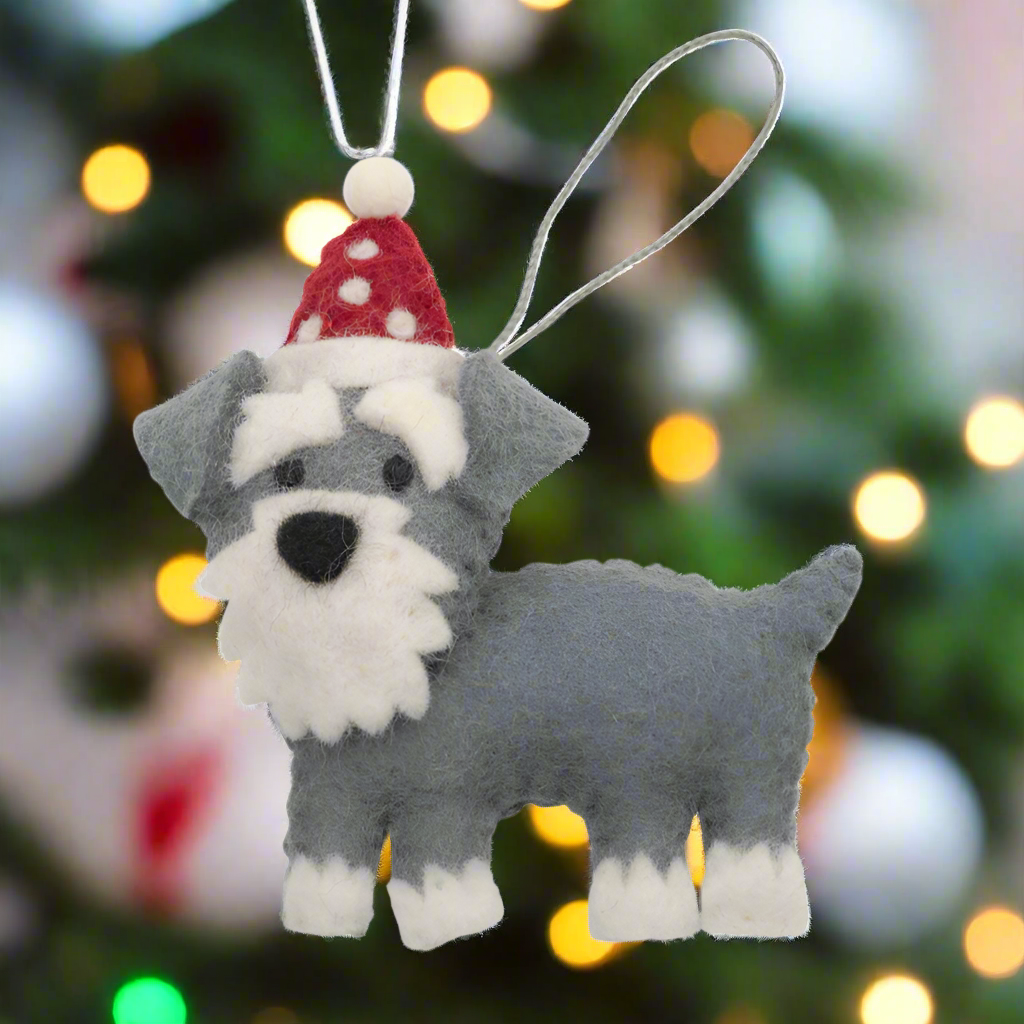 Plush dog toy with a red and white hat on a white background