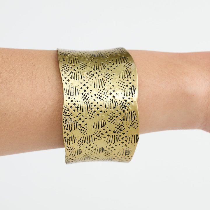 gold cuff on ladies wrist