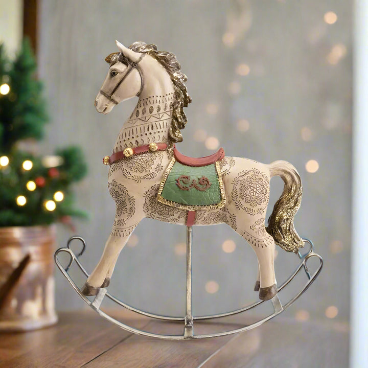 Decorative rocking horse with intricate patterns on a white background