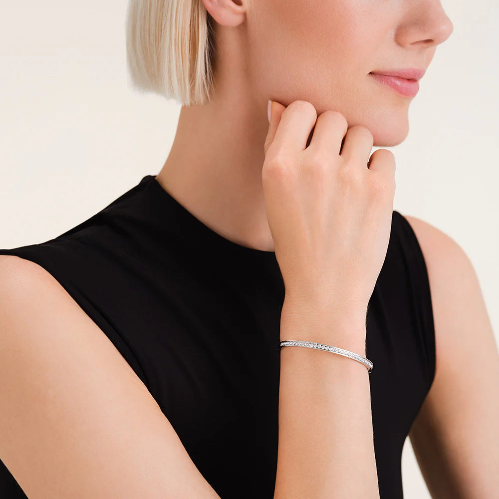 Woman wearing a Rosefield Silver Channel Bangle