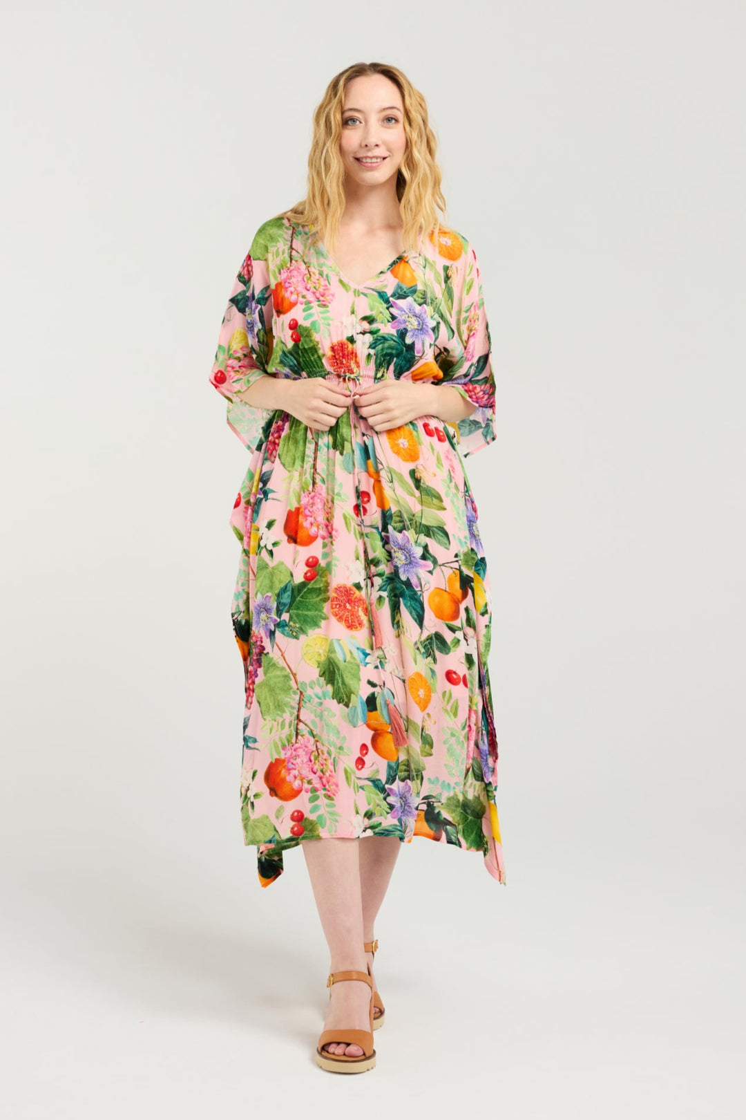 Woman wearing a floral dress on a white background