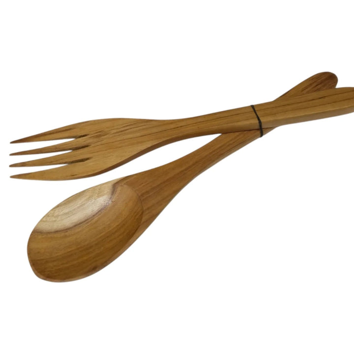A wooden salad server set consisting of a spoon and a fork tied together with a thin black string, shown on a plain white background.
