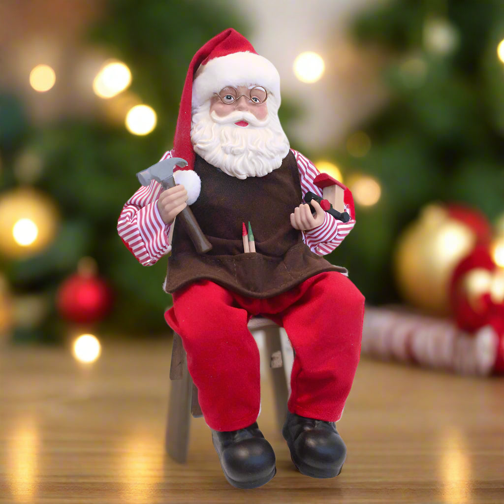 Santa Claus doll with a hammer and pliers on a white background