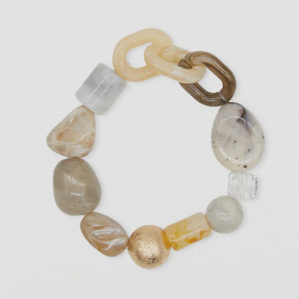 Multicolored beaded bracelet on a light gray background