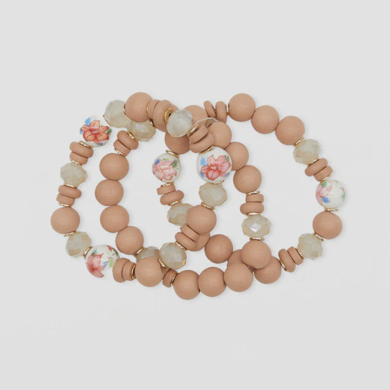 Set of beaded bracelets on a light background