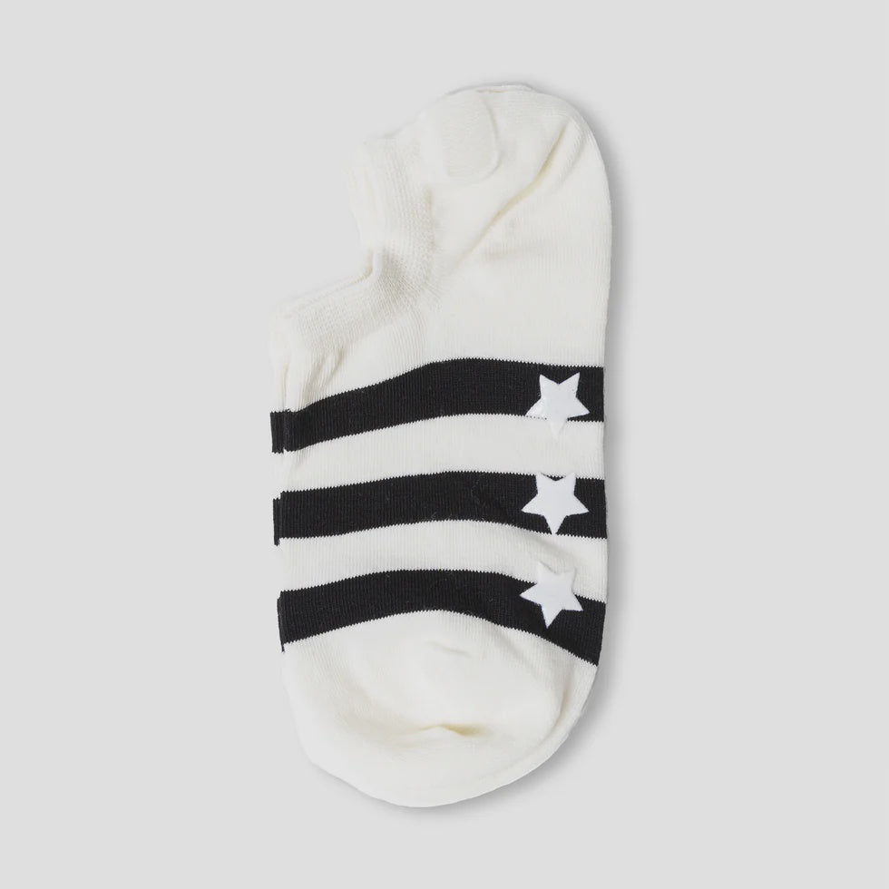 White sock with black star and stripe pattern on a light gray background