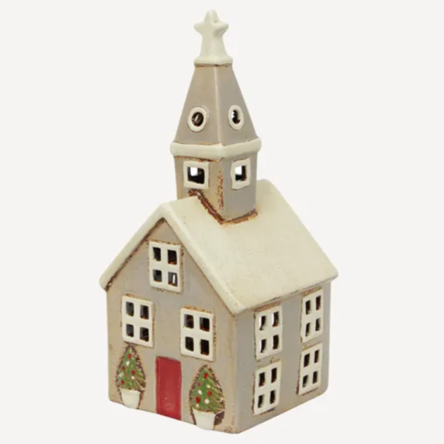 Decorative model of a church with a steeple on a white background
