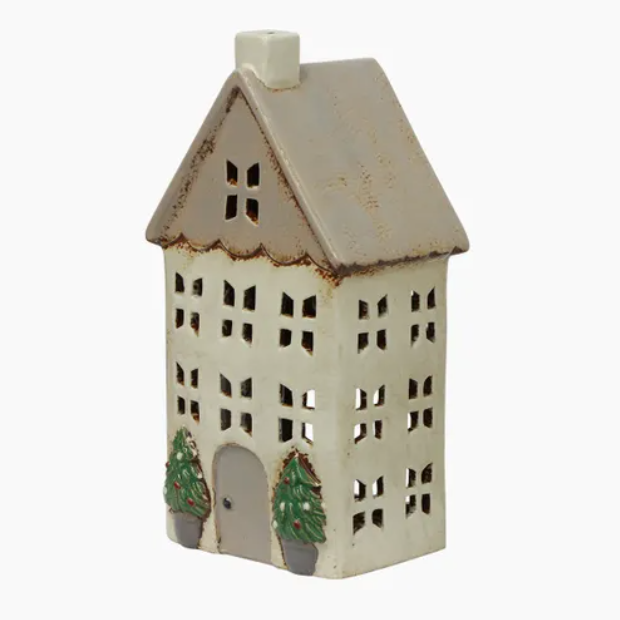 Small ceramic house-shaped lantern with a white base and brown roof on a white background