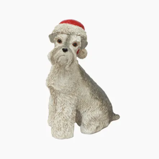Plush toy dog with a red and white hat on a white background