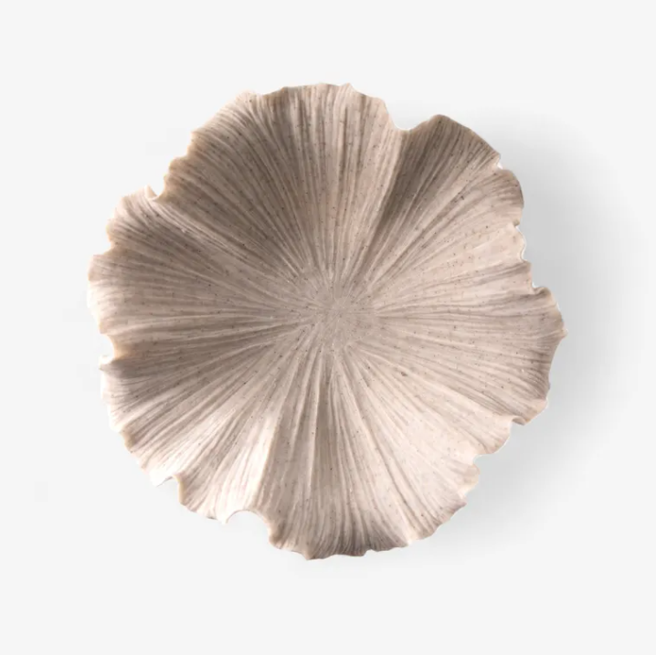 Decorative wall art with a fan-like design on a white background