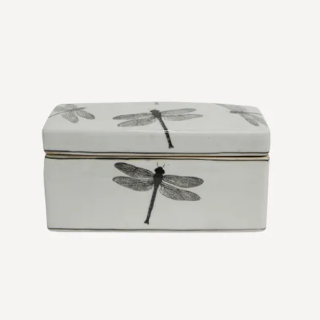 White decorative box with dragonfly design on a white background