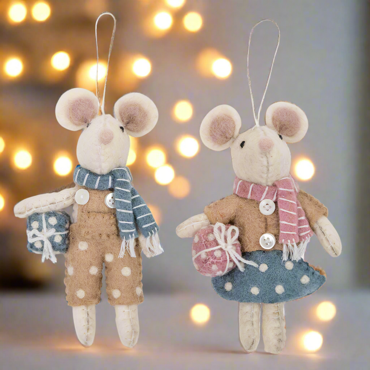 Two plush mouse toys with scarves and outfits on a white background