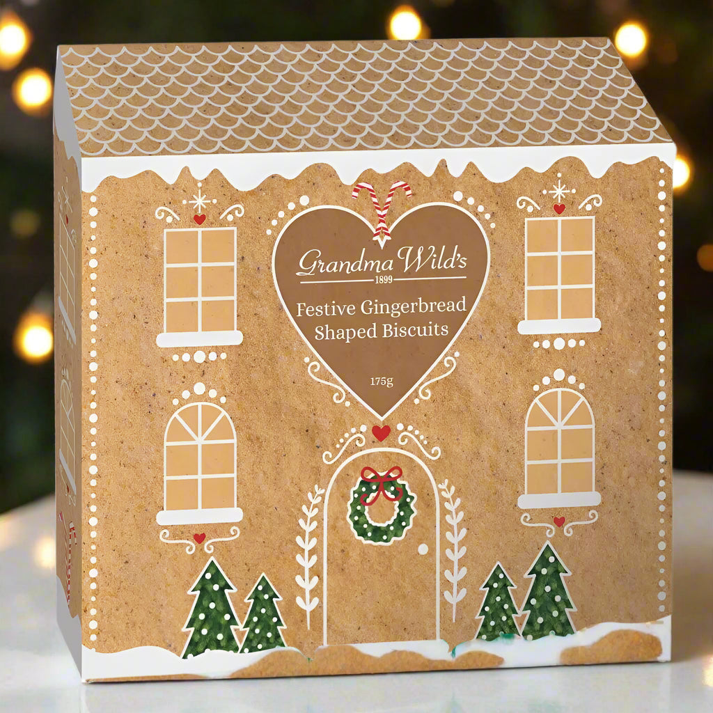 Box of Grandma Wild's Festive Gingerbread Shaped Biscuits with gingerbread house design.