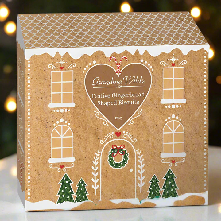 Box of Grandma Wild's Festive Gingerbread Shaped Biscuits with gingerbread house design.