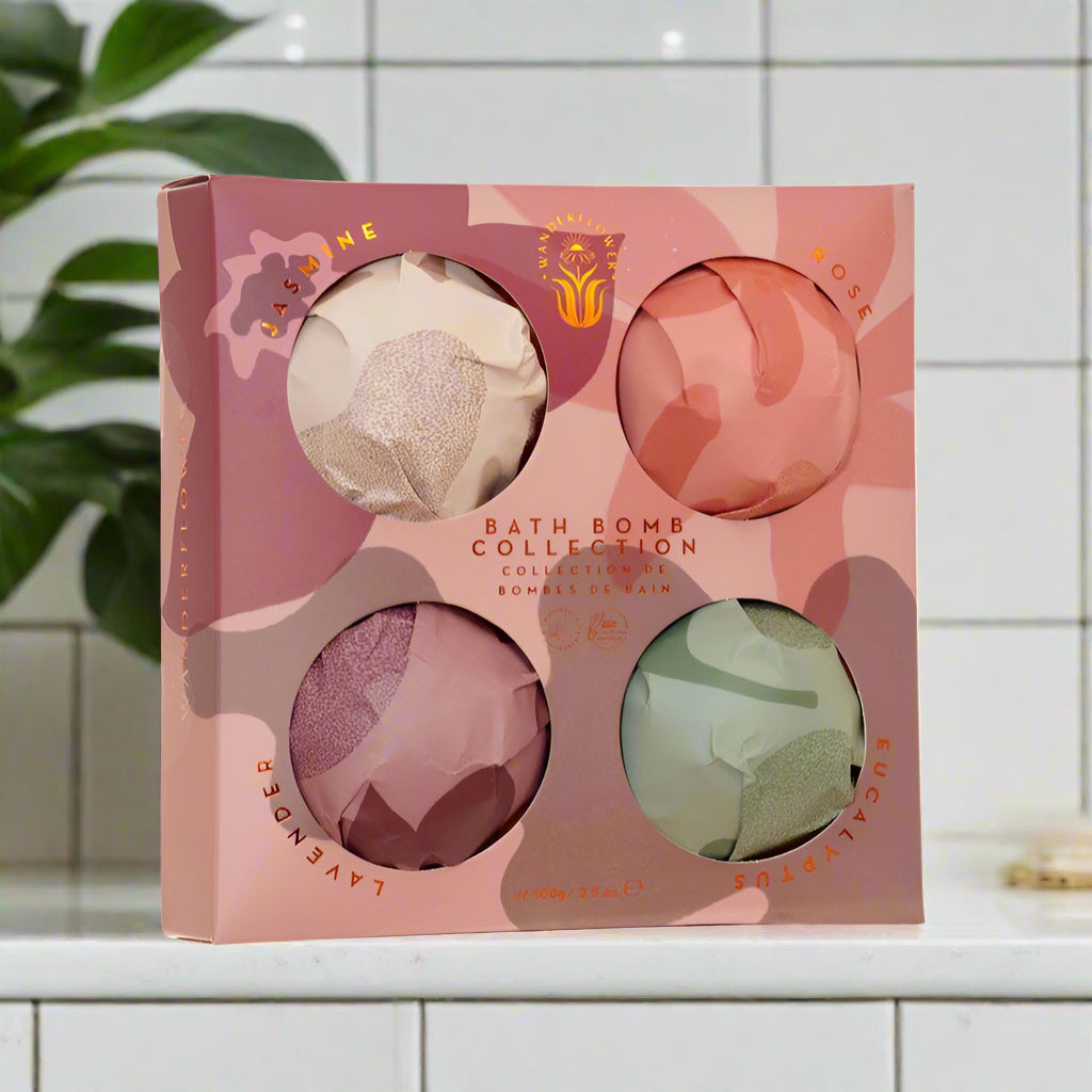 Box of bath bombs with colorful packaging on a white background