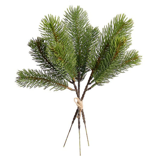 Artificial pine branch with green needles on a white background