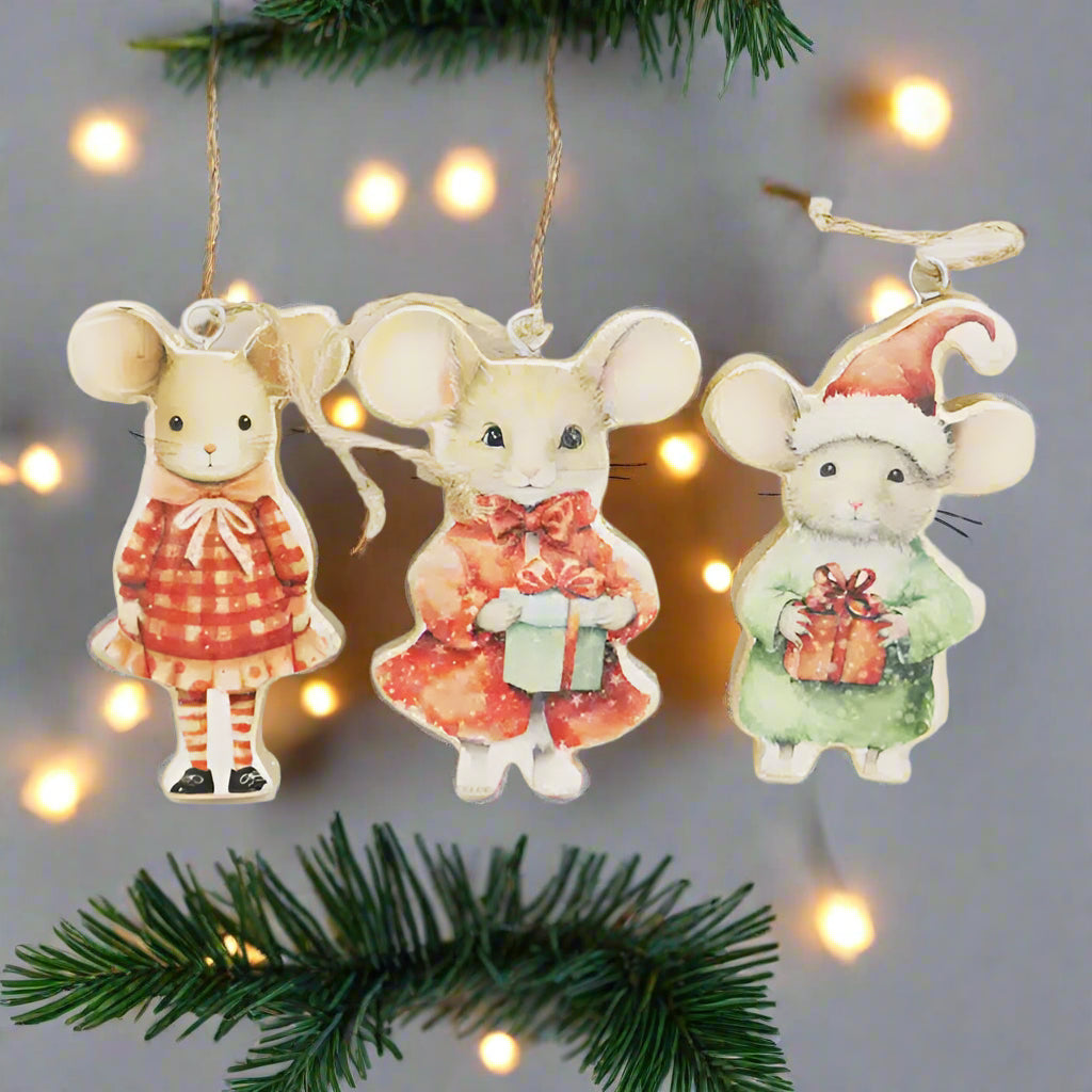 Three decorative mouse ornaments on a white background