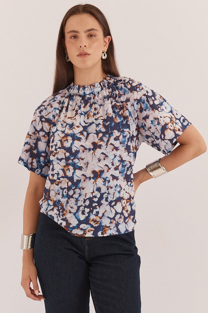 BLUE PRINT BLOUSE ON LADY IN STUDIO SETTING