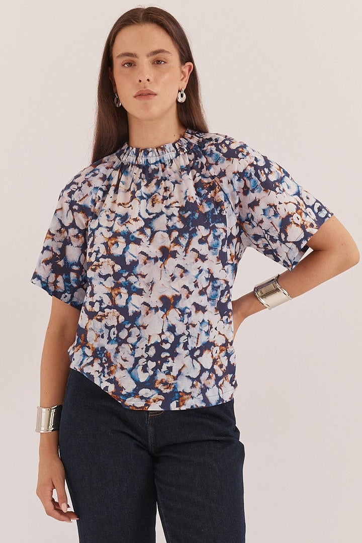 BLUE PRINT BLOUSE ON LADY IN STUDIO SETTING