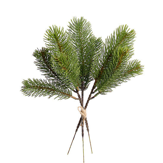 Artificial pine branch with green needles on a white background