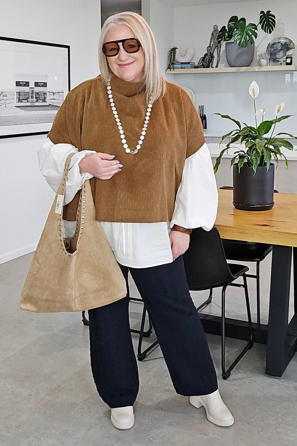 Person lying on a staircase in a modern interior setting