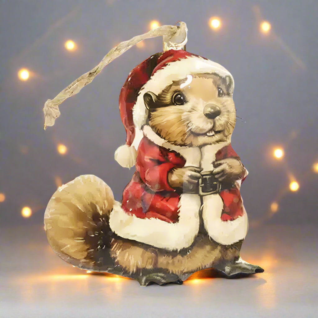 Christmas ornament of a squirrel in a Santa hat and coat on a white background