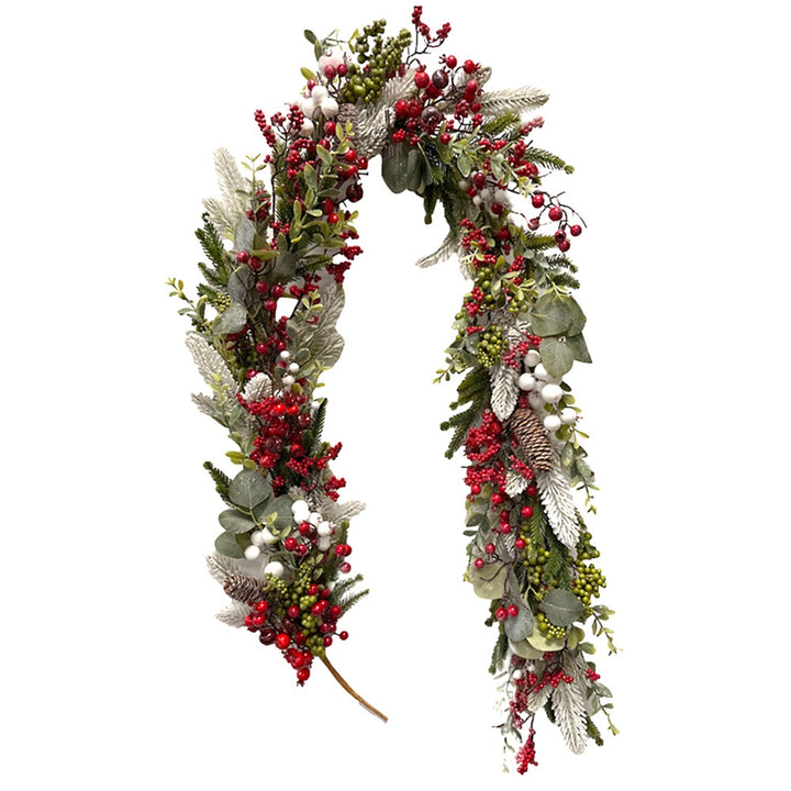 Decorative garland with red berries and green leaves on a white background