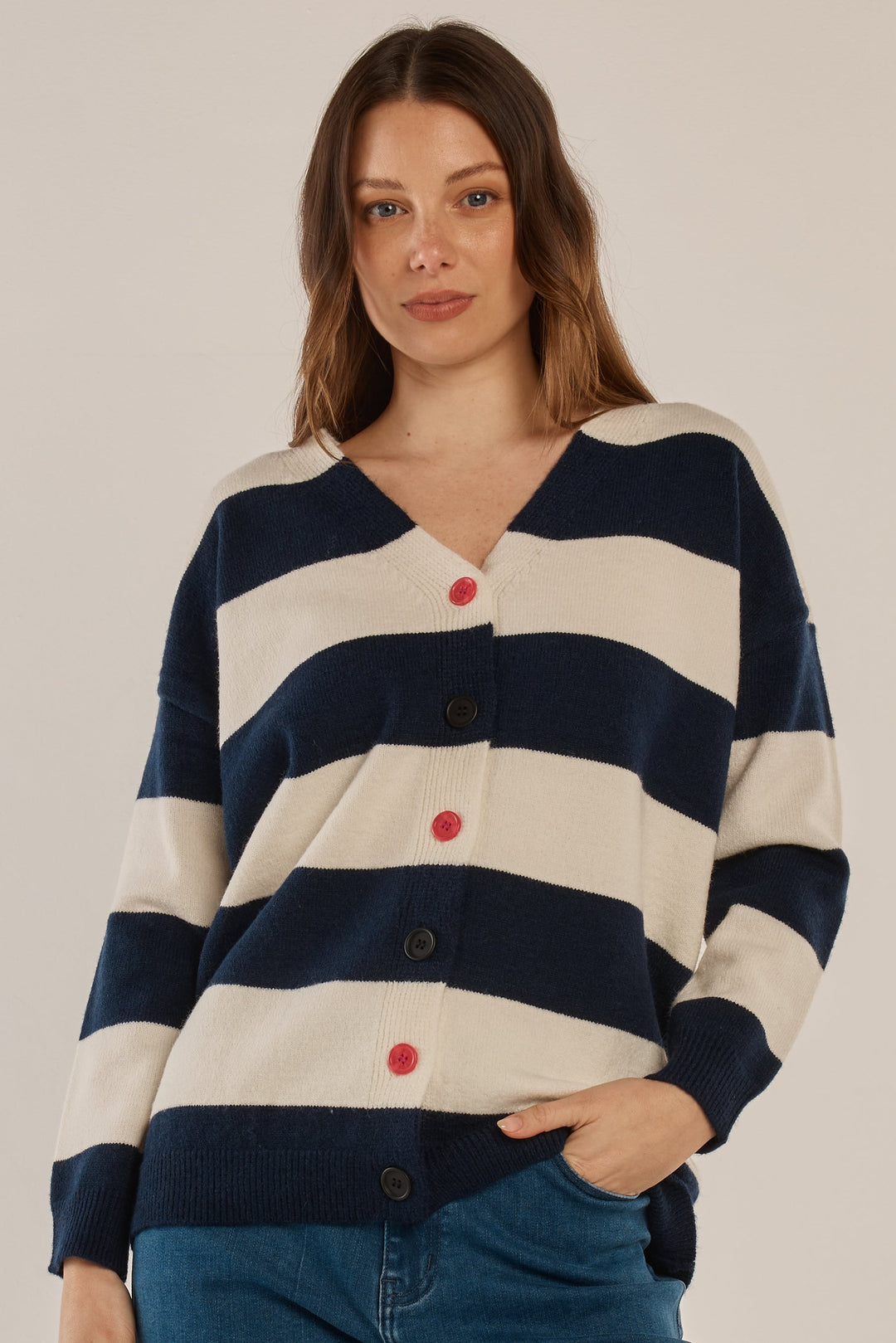 woman wearing a navy & off white stripe cardigan with jeans. relaxed casual loo