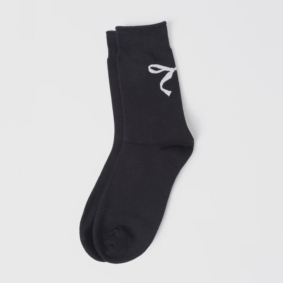 Black sock with a white logo on a light gray background