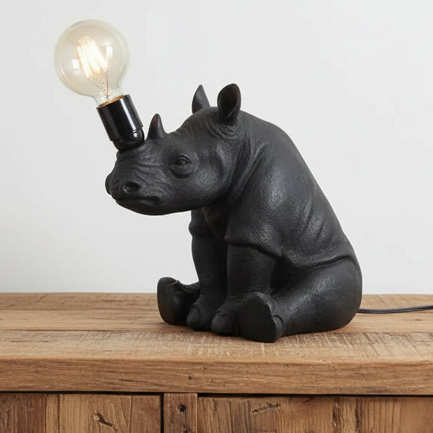 Black rhinoceros lamp with a light bulb on a white background