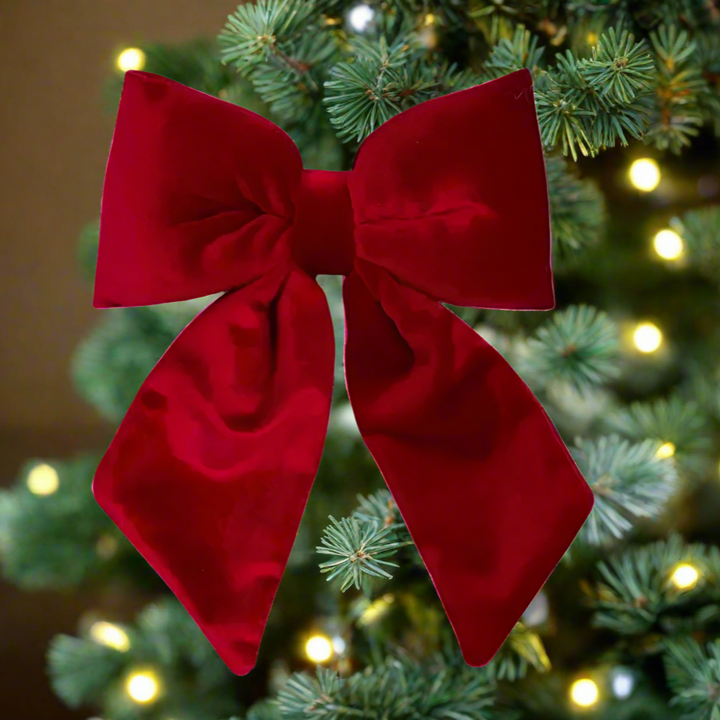 Red velvet bow on a white background
