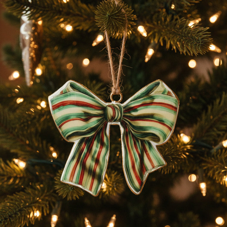 Decorative bow ornament with red and green stripes on a white background